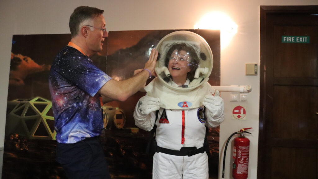 Trying on a real astronaut suit.