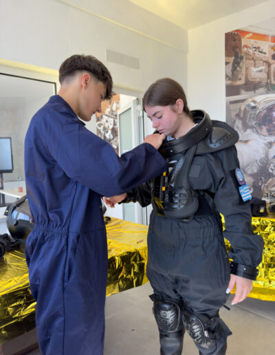 Fabian helping Angelika donning
