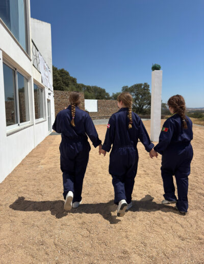 Astronaut girls walking hand in hand