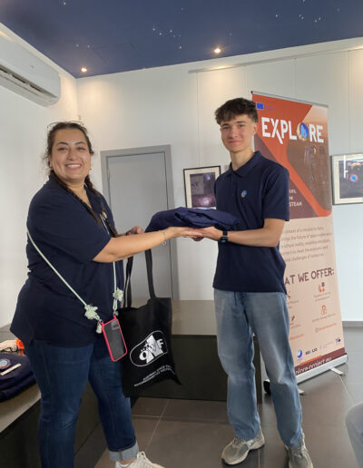 Seda handing over the mission uniform to Fabian